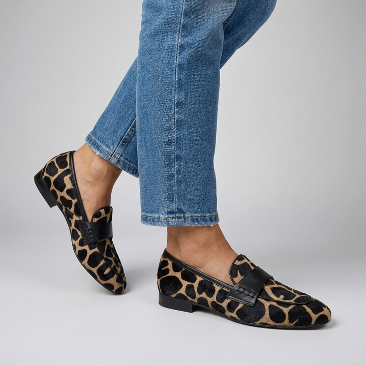 Moo-dern Chic: Statement Cow Print Loafers